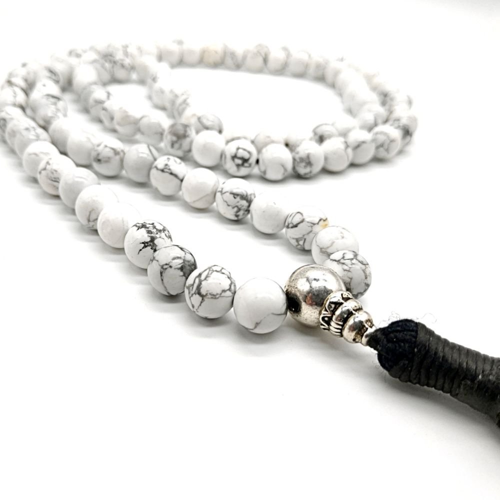 https://monkmala.com/wp-content/uploads/Howlite-Buddhist-Mala-Bead-Necklace-BlackTassle.jpg?utm_source=chatgpt.com